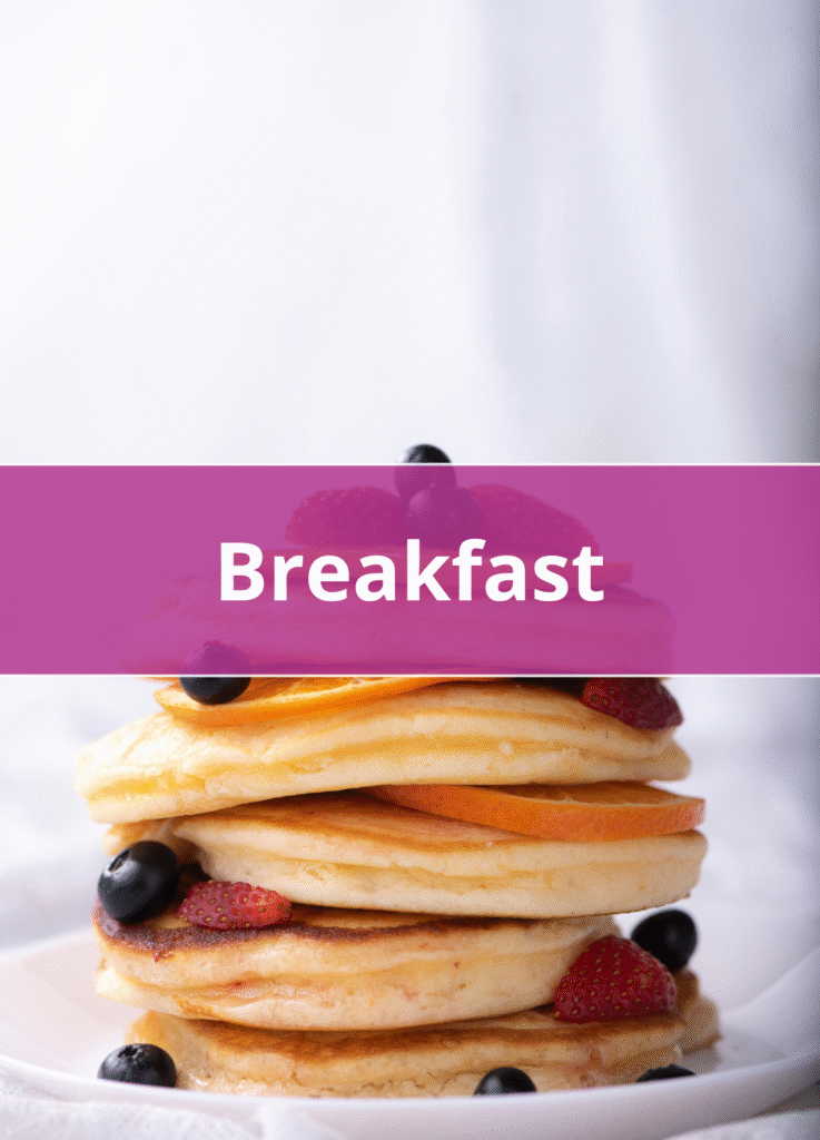 Stack of fluffy pancakes topped with fresh berries and syrup healthy breakfast option.