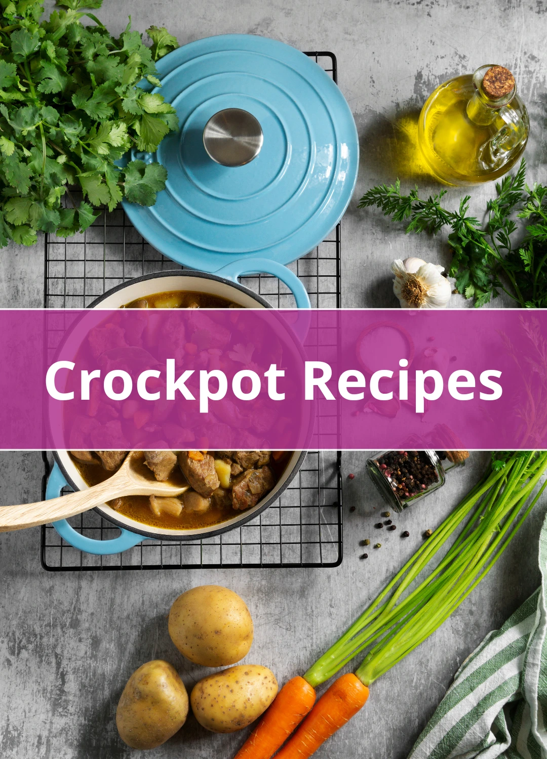 Blue Dutch oven filled with hearty beef and vegetable stew surrounded by fresh carrots, potatoes, herbs, garlic, and olive oil.