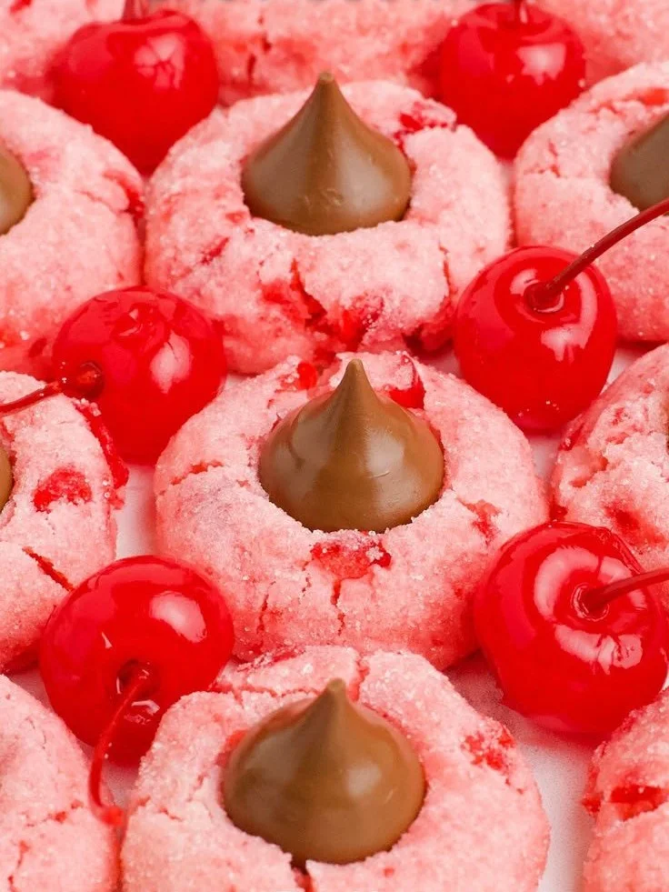 Freshly baked cherry blossom cookies decorated with pink frosting