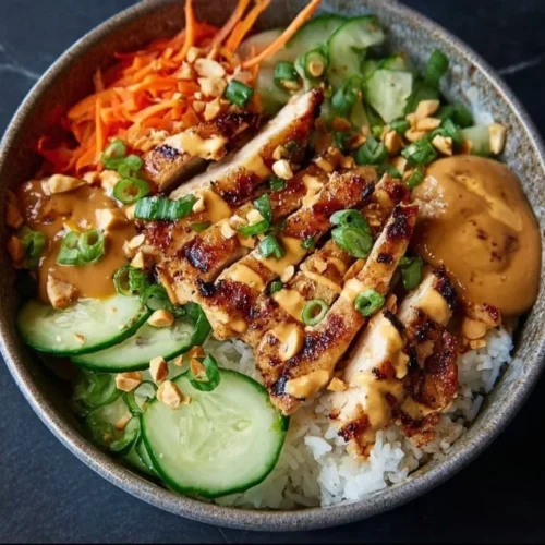 Thai Peanut Chicken Buddha Bowl with vibrant vegetables and creamy peanut sauce