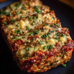 Delicious Garlic Parmesan Chicken Meatloaf served on a plate.