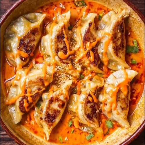 Viral baked dumplings served with vibrant red curry sauce