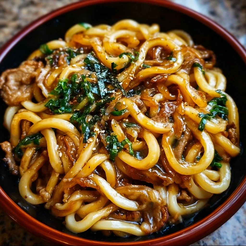 Delicious Yaki Udon noodles in a stir-fry with colorful vegetables.