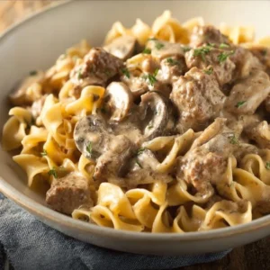 Instant Pot Hamburger Stroganoff served in a bowl with creamy sauce and noodles