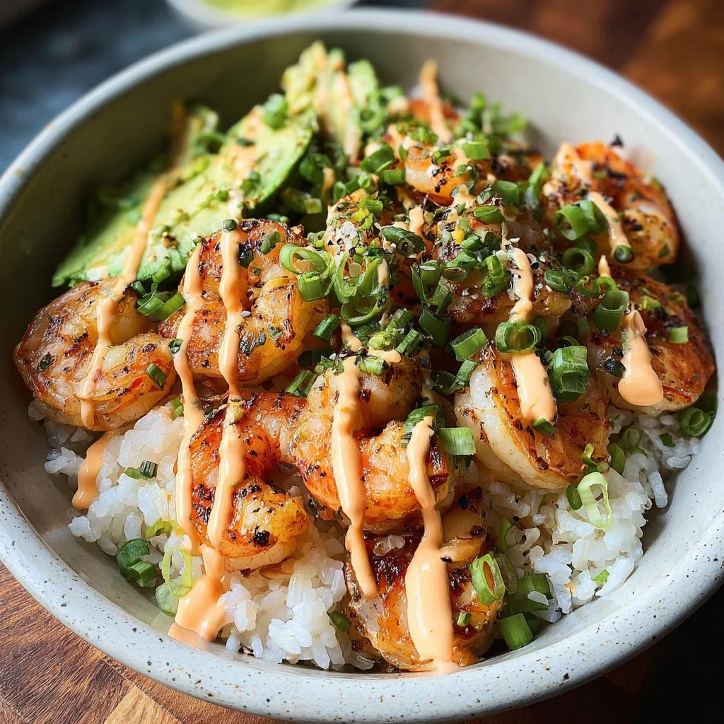 Shrimp rice bowls topped with spicy mayo, perfect for a flavorful meal.