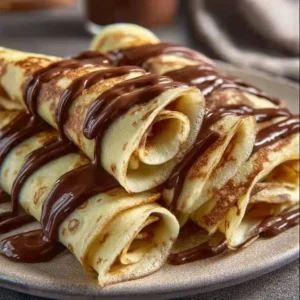 Stack of fluffy basic pancakes served with syrup and berries