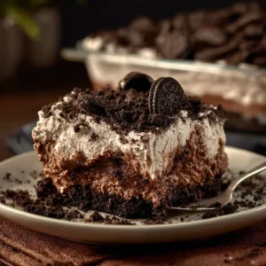Delicious Oreo Dirt Cake topped with crushed Oreos and gummy worms.